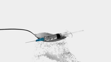 Syringe-falling-onto-spoon-full-of-sugar