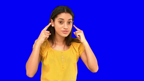 Woman-pointing-to-her-temples-on-blue-screen