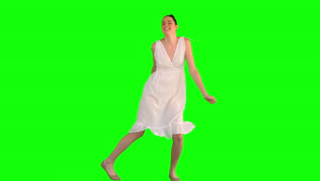 Happy-model-in-white-dress-dancing