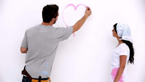 Attractive-man-painting-a-heart