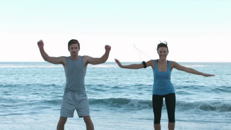 Attractive-people-working-out-on-the-beach