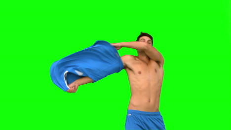 Handsome-football-player-celebrating-a-goal-on-green-screen