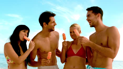 Friends-laughing-and-eating-ice-cream-on-the-beach