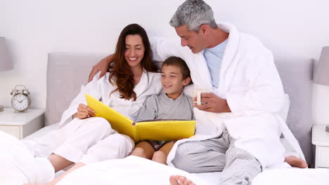 Parents-and-their-son-reading-story