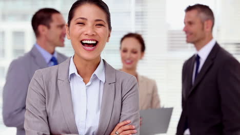 Businesswoman-laughing-and-looking-at-camera-