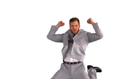 Excited-businessman-jumping-on-white-background