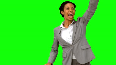 Cheerful-woman-waving-at-someone-on-green-screen