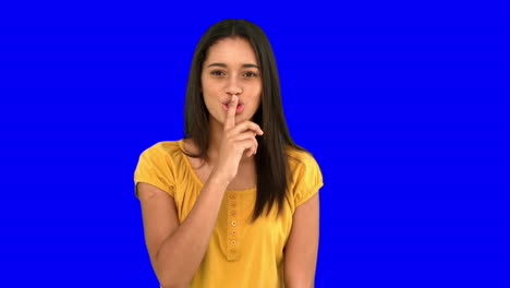 Woman-asking-for-silence-on-blue-screen