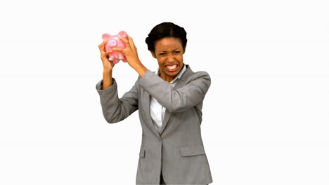 Businesswoman-listening-to-an-empty-piggy-bank-on-white-screen