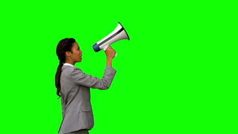 Businesswoman-shouting-into-a-megaphone-on-green-screen