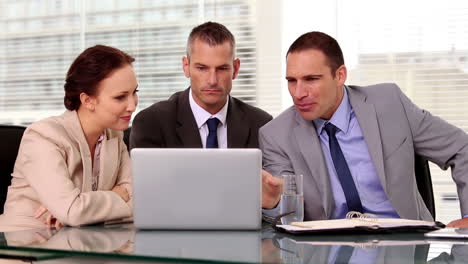 Business-people-working-together-a-laptop