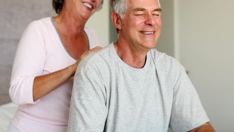 Man-enjoying-shoulder-massage-given-by-his-wife