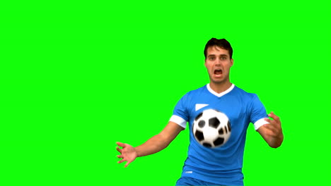 Man-controlling-a-football-with-his-chest-on-green-screen-