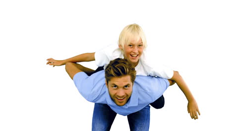 Son-having-a-piggy-back-on-his-father-on-white-background