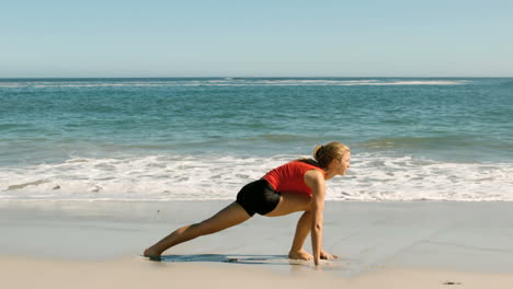 Woman-doing-exercises-at-the-beach