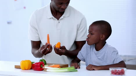 Father-and-his-son-choosing-vegetables