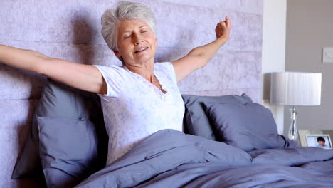 Old-woman-waking-up-and-stretching