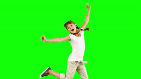 Little-girl-jumping-on-green-screen