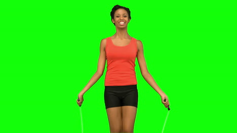 Woman-working-out-with-a-rope-on-green-screen