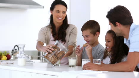 Mother-offering-cookies-to-her-family