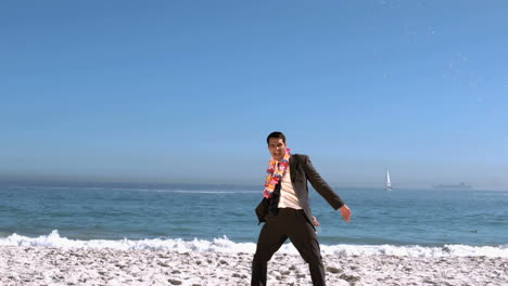 Businessman-on-the-beach-throwing-his-cocktail-glass