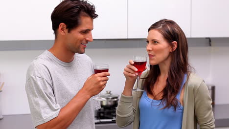 Couple-toasting-in-the-kitchen