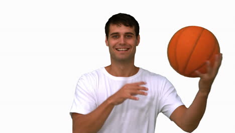 Man-playing-with-a-basketball-on-white-screen-in-slow-motion