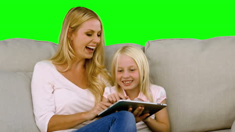 Mother-and-her-daughter-using-digital-tablet-in-slow-motion