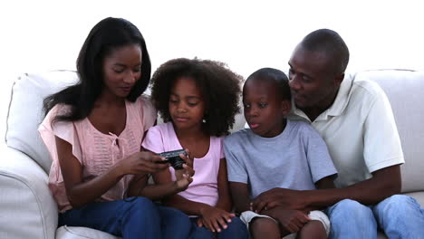 Family-taking-picture-sitting-on-a-sofa