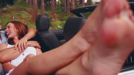 Beautiful-woman-lying-on-her-boyfriend-in-a-car