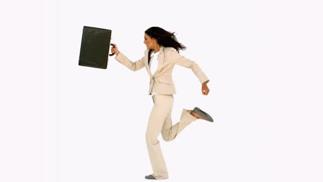 Businesswoman-jumping-in-the-air-with-her-suitcase