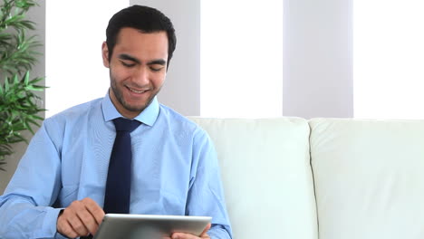 Businessman-using-his-tablet