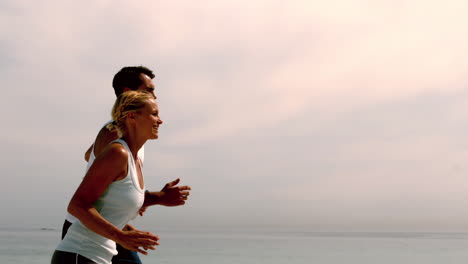 Joggers-jogging-across-the-beach