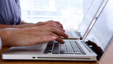 Close-up-of-hands-typing-on-laptop