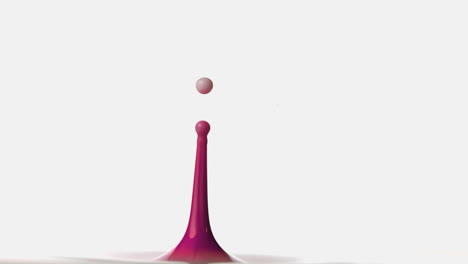 Drop-falling-on-pink-paint