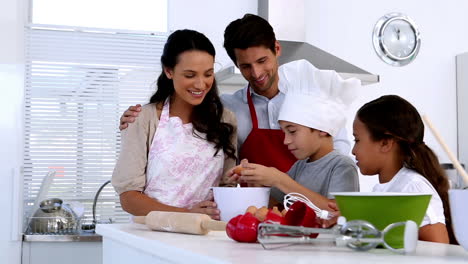 Family-preparing-pastry-together