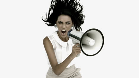 Angry-businesswoman-shouting-on-megaphone-and-jumping