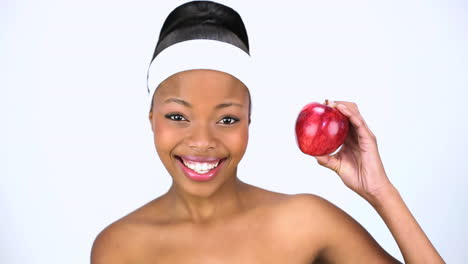 Attractive-woman-holding-red-apple