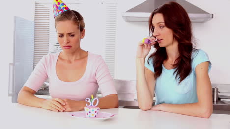 Woman-cheering-up-her-upset-friend-on-her-30th-birthday
