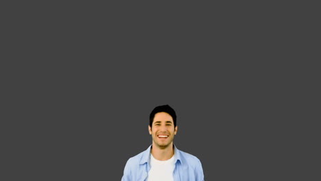 Man-jumping-for-joy-on-grey-background