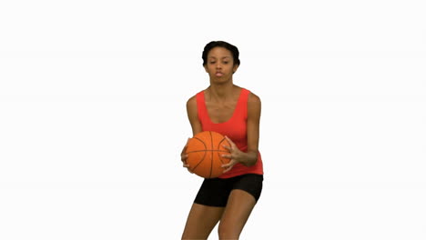 Pretty-woman-catching-and-throwing-a-basketball-on-white-screen