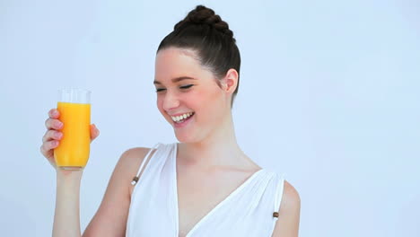 Beautiful-woman-holding-a-glass-of-orange-juice