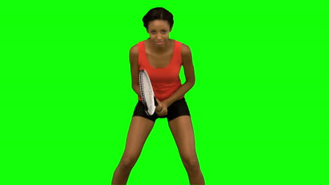 Woman-playing-tennis-on-green-screen