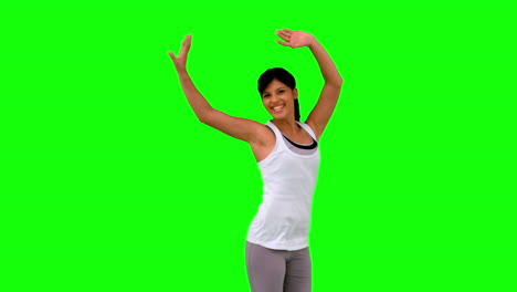 Woman-in-sportswear-jumping-on-green-screen