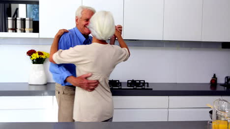 Couple-dancing-together-in-kitchen