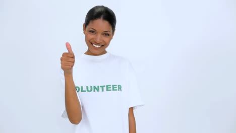 Volunteer-woman-smiling-and-does-a-thumb-up-at-camera