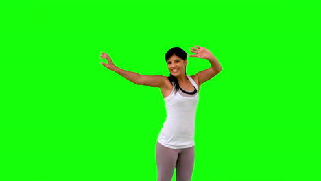 Woman-in-sportswear-leaping-on-green-screen