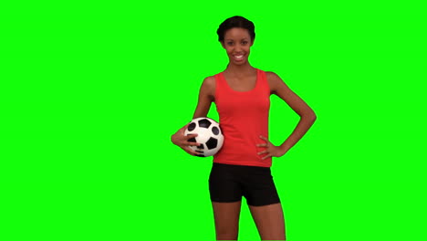 Woman-catching-a-football-on-green-screen
