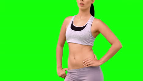 Athletic-woman-tossing-hair-on-green-screen