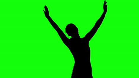 Silhouette-of-woman-raising-arms-on-green-screen